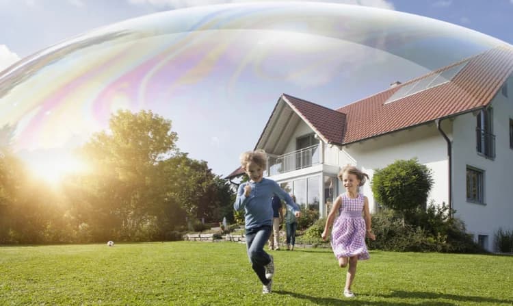 Kids running across a sunlit Minnesota lawn — the yard a real local installer protects